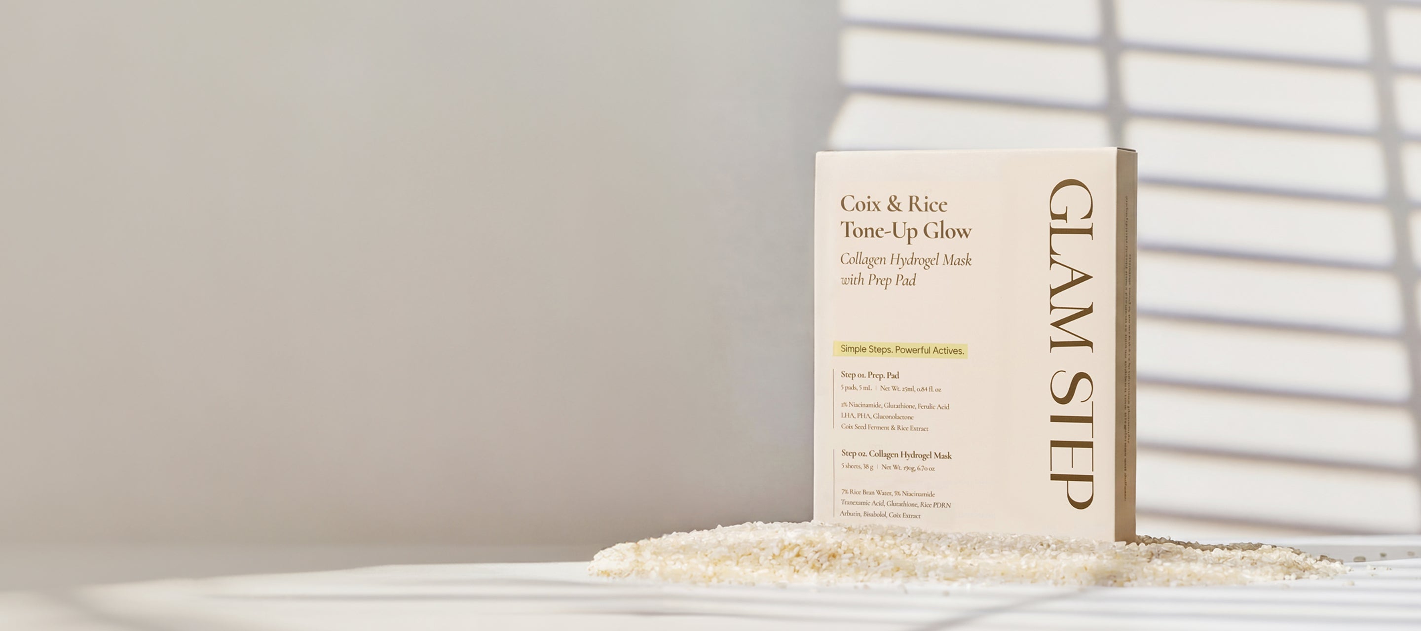 Coix & Rice Tone-Up Glow packaging placed on rice under the sunlight