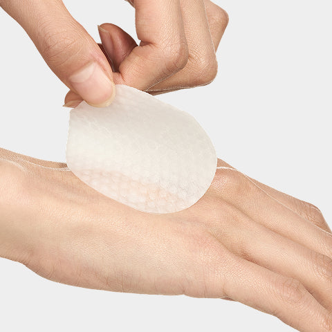 Hands applying the Prep pad