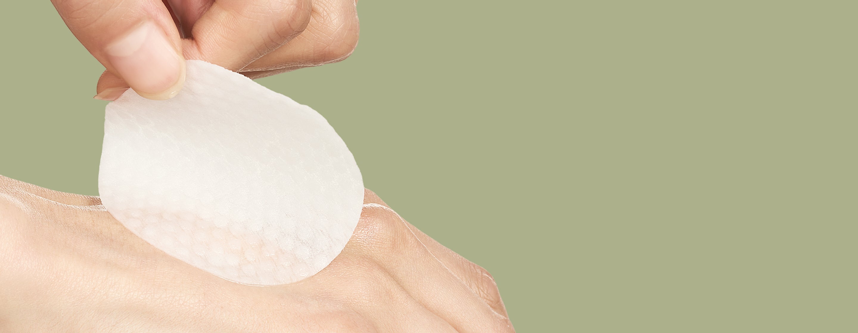 Hands applying the Prep pad